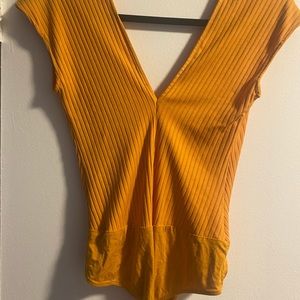 Golden Zara bodysuit perfect for summer & fall layering. Features v-neckline
